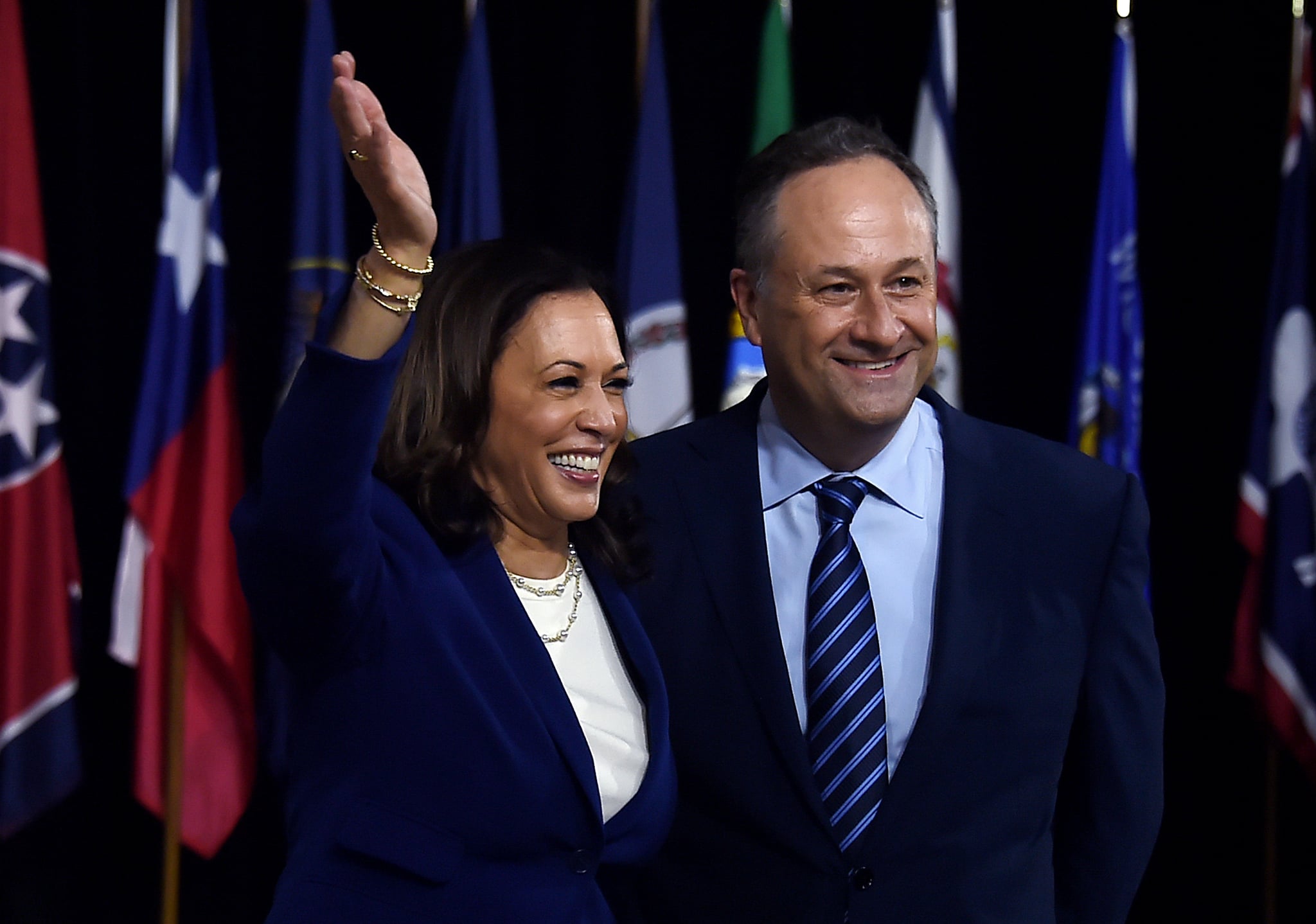 Democratic vice presidential running mate, US Senator Kamala Harris and her husband Douglas Emhoff pose on stage after the first Biden-Harris press conference in Wilmington, Delaware, on August 12, 2020. (Photo by Olivier DOULIERY / AFP) (Photo by OLIVIER DOULIERY/AFP via Getty Images)