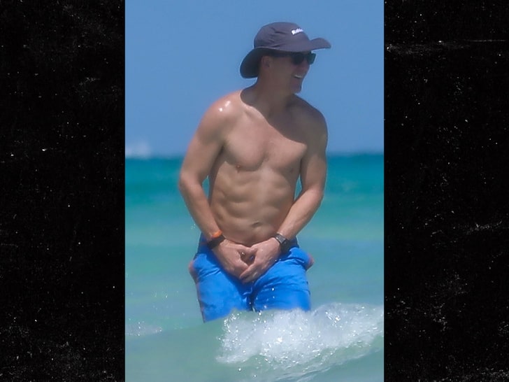 Peyton Manning Has a 6-Pack?! QB Flexes Impressive Physique On Beach Vacay