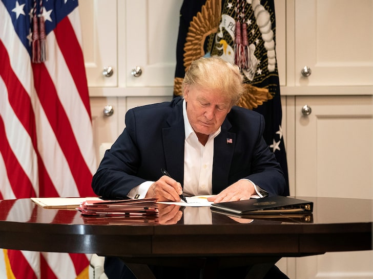 President Trump Appears to Sign Blank Paper as Proof He's Working Hard