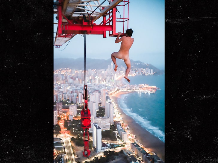 Daredevil Hangs Naked from 660-ft Crane with No Rope