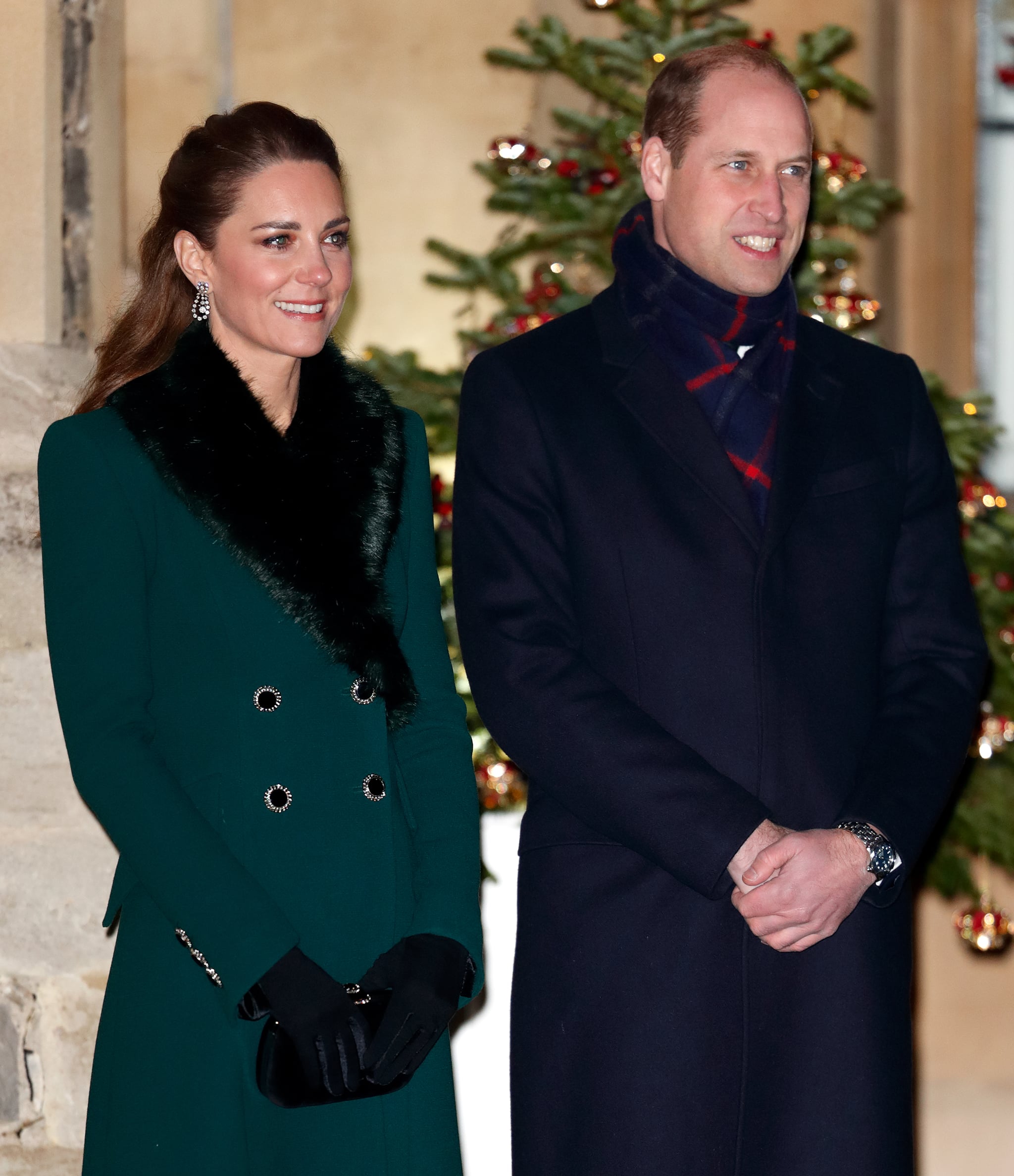 WINDSOR, UNITED KINGDOM - DECEMBER 08: (EMBARGOED FOR PUBLICATION IN UK NEWSPAPERS UNTIL 24 HOURS AFTER CREATE DATE AND TIME) Catherine, Duchess of Cambridge and  Prince William, Duke of Cambridge attend an event to thank local volunteers and key workers from organisations and charities in Berkshire, who will be volunteering or working to help others over the Christmas period in the quadrangle of Windsor Castle on December 8, 2020 in Windsor, England. During the event members of the Royal Family also listened to Christmas carols performed by The Salvation Army Band. (Photo by Max Mumby/Indigo - Pool/Getty Images)