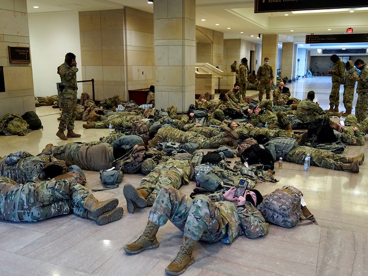 Exhausted, Armed National Guard Members Sleep on Capitol Floor