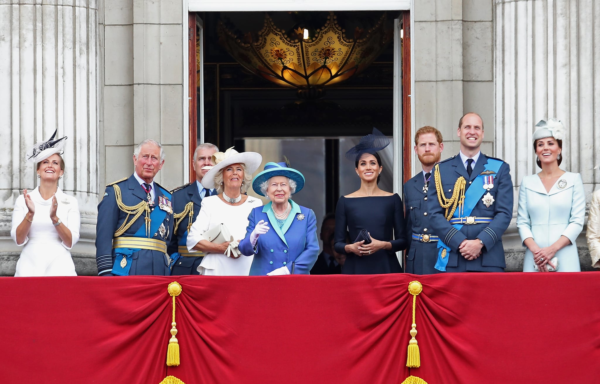 LONDON, ENGLAND - JULY 10:  (L-R) Prince Charles, Prince of Wales, Prince Andrew, Duke of York, Camilla, Duchess of Cornwall, Queen Elizabeth II, Meghan, Duchess of Sussex, Prince Harry, Duke of Sussex, Prince William, Duke of Cambridge and Catherine, Duchess of Cambridge watch the RAF flypast on the balcony of Buckingham Palace, as members of the Royal Family attend events to mark the centenary of the RAF on July 10, 2018 in London, England.  (Photo by Chris Jackson/Getty Images)
