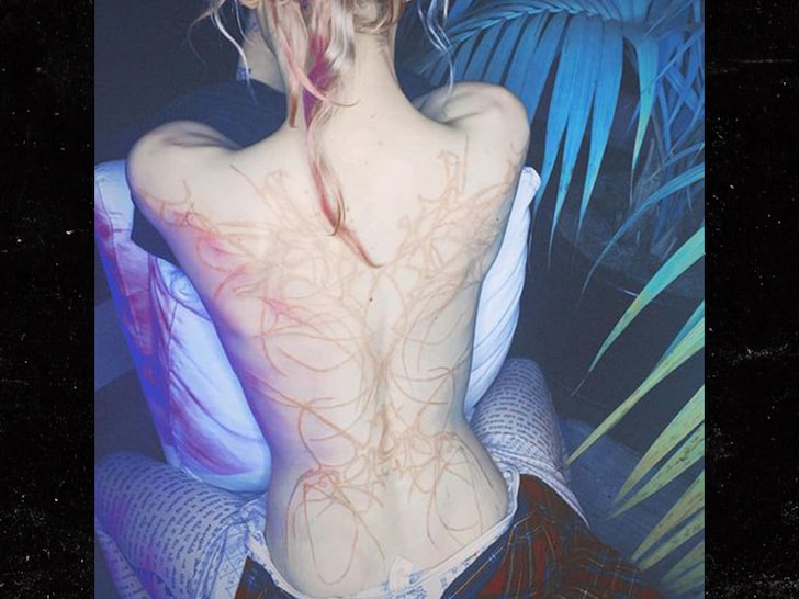 Grimes Reveals Massive Back Tattoo of 'Beautiful Alien Scars'