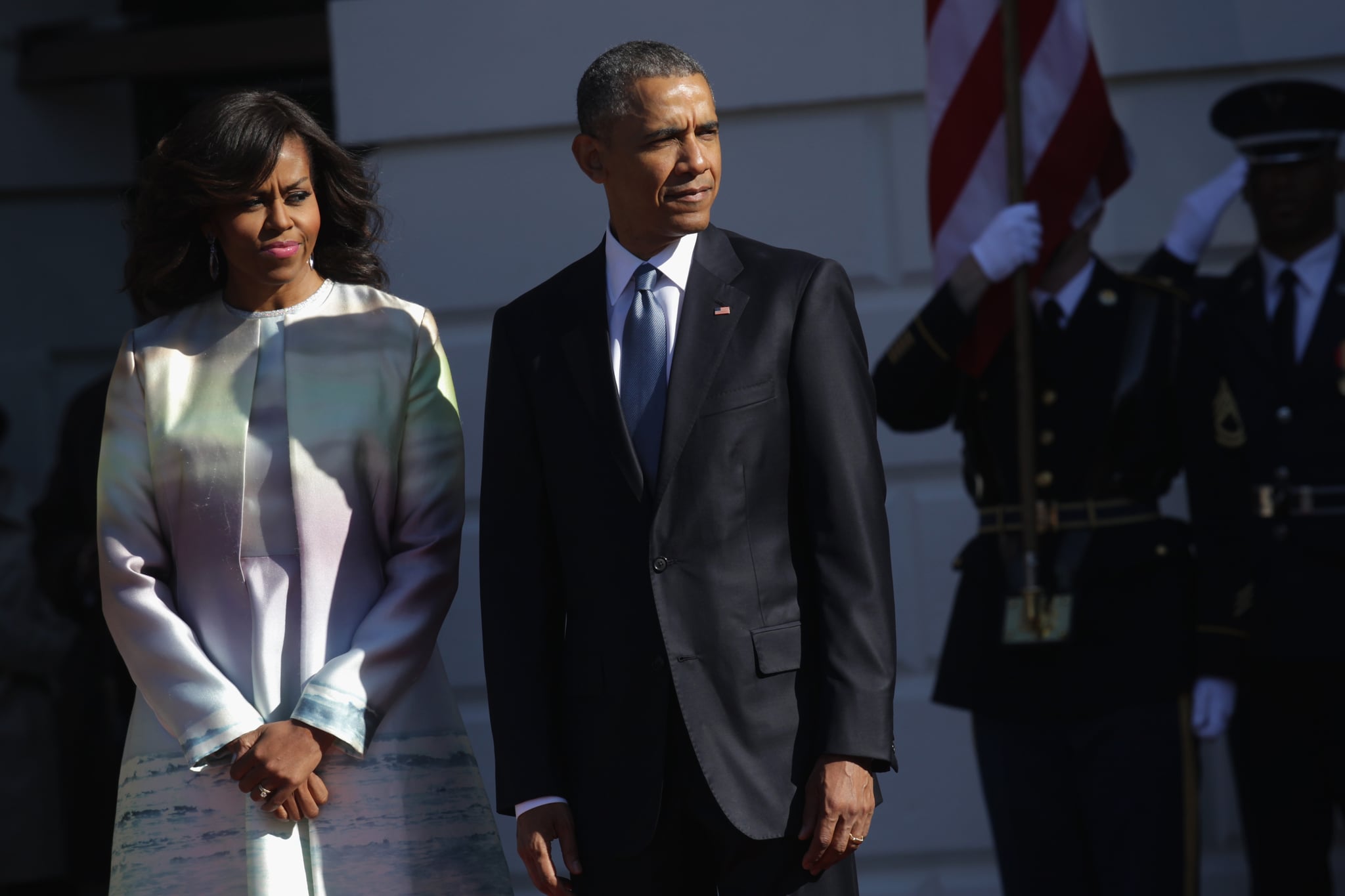 WASHINGTON, DC - APRIL 28:  (AFP OUT) U.S. President Barack Obama (R) and first lady Michelle Obama (L) wait for the arrival of Japanese Prime Minister Shinzo Abe and his wife Akie Abe during an official arrival ceremony at the South Lawn of the White House April 28, 2015 in Washington, DC. The Japanese Prime Minister and his wife are on an official visit to Washington.  (Photo by Alex Wong/Getty Images)