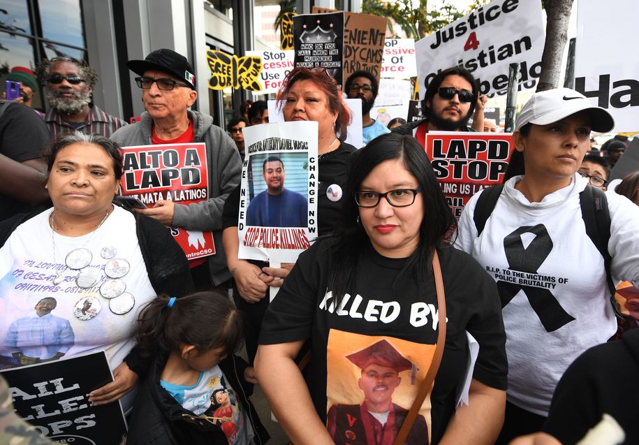 Family members of victims and their supporters, protest against police violence and the use of excessive force and killings during a demonstration in Hollywood, California, on December 23, 2018. (Photo by Mark RALSTON / AFP)        (Photo credit should read MARK RALSTON/AFP/Getty Images)