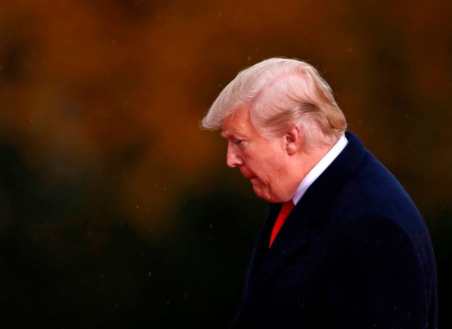 US President Donald Trump visits the American Cemetery of Suresnes, outside Paris, on November 11, 2018 as part of Veterans Day and the commemorations marking the 100th anniversary of the 11 November 1918 armistice, ending World War I. (Photo by CHRISTIAN HARTMANN / POOL / AFP)        (Photo credit should read CHRISTIAN HARTMANN/AFP/Getty Images)