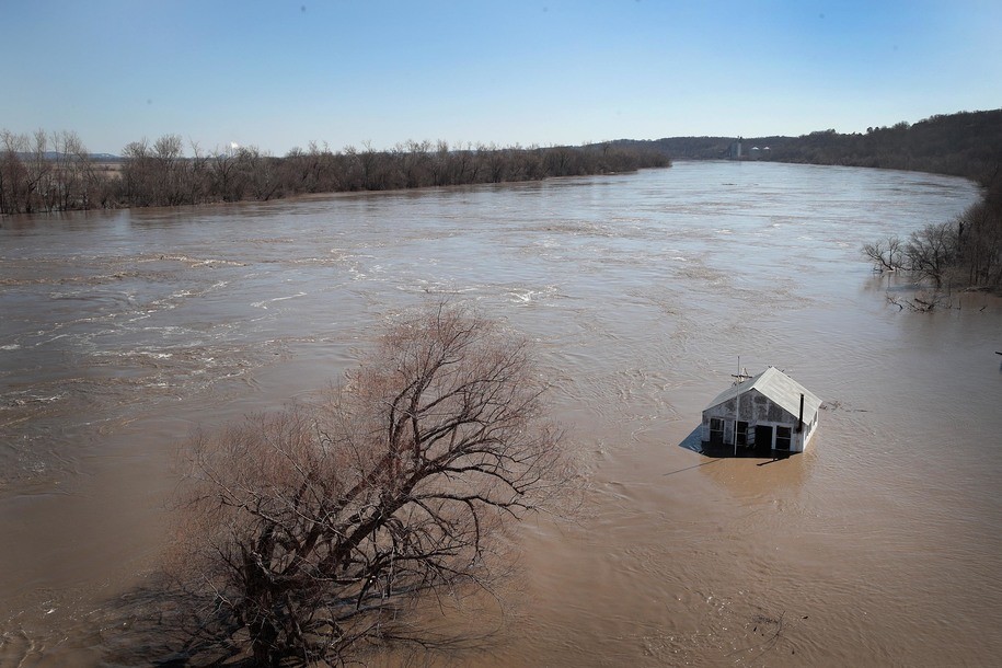 ATCHISON, MISSOURI - MARCH 21:  A structure is surrounded by floodwater on March 21, 2019 in Atchison, Kansas. Several Midwest states are battling some of the worst flooding they have experienced in decades as rain and snow melt from the recent