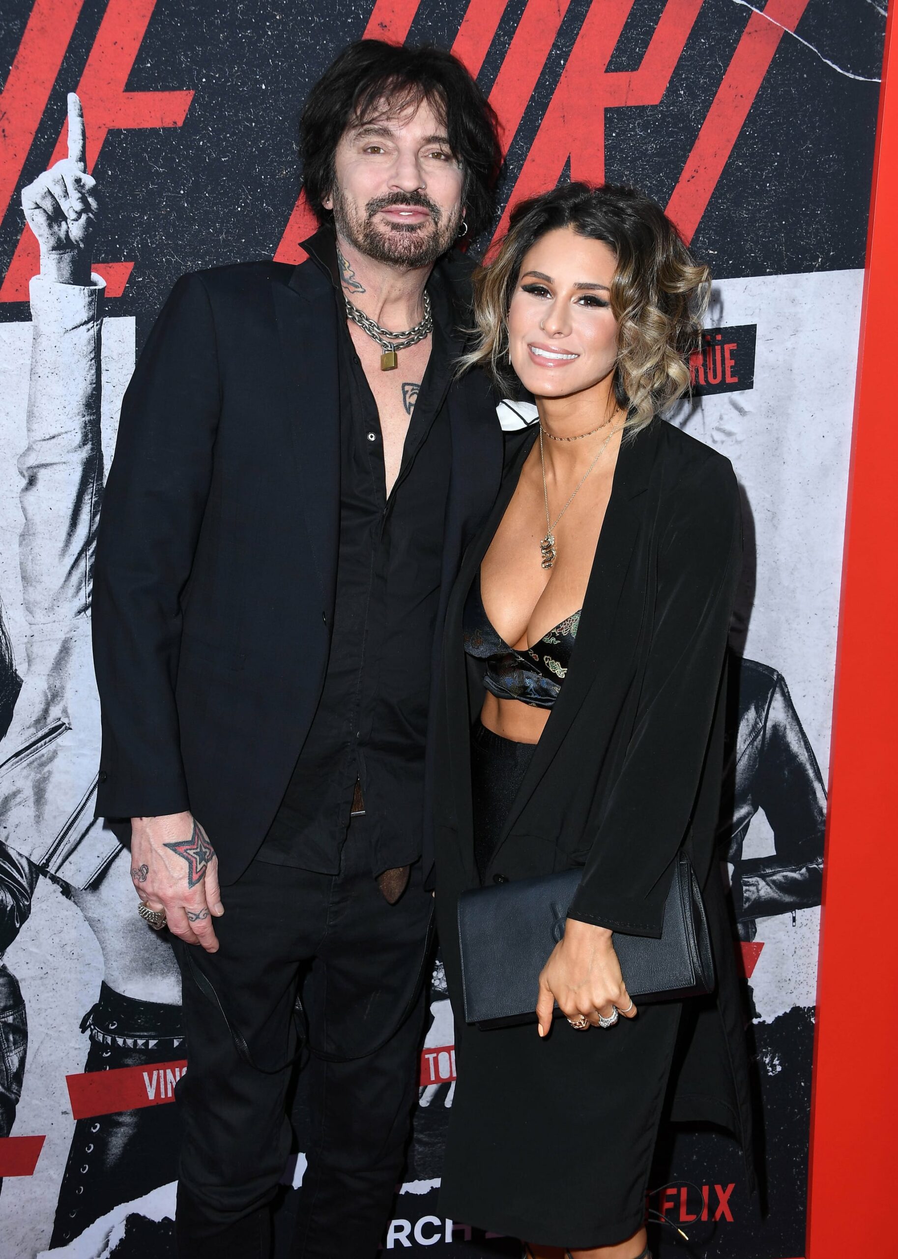 HOLLYWOOD, CALIFORNIA - MARCH 18: Tommy Lee and Brittany Furlan arrive at the Premiere Of Netflix