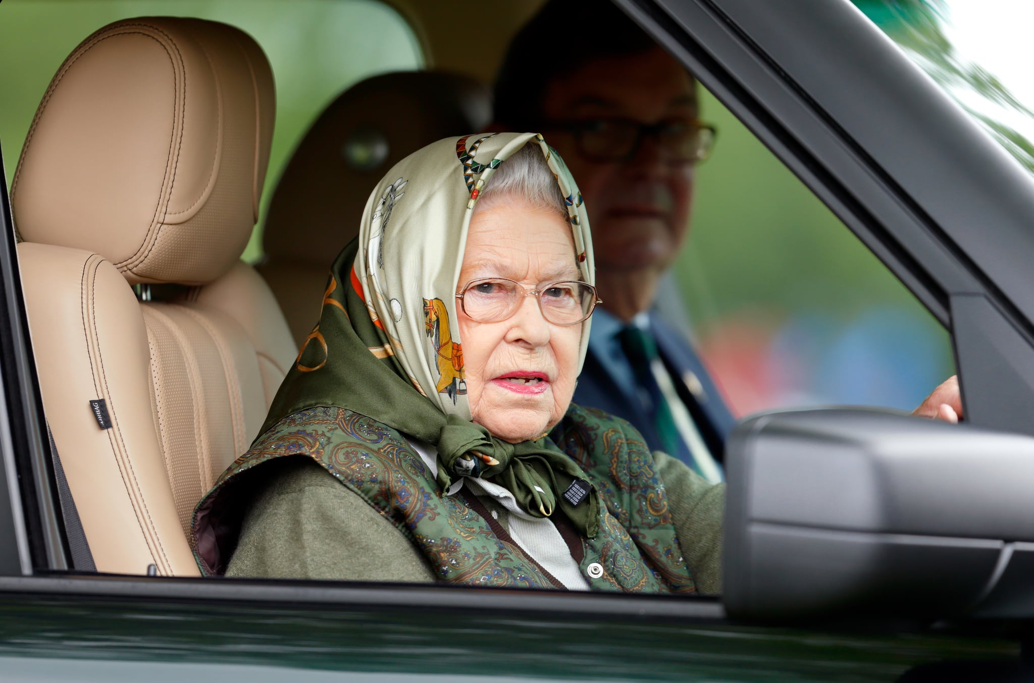 WINDSOR, UNITED KINGDOM - MAY 13: (EMBARGOED FOR PUBLICATION IN UK NEWSPAPERS UNTIL 48 HOURS AFTER CREATE DATE AND TIME) Queen Elizabeth II drives her Range Rover car as she attends day 4 of the Royal Windsor Horse Show in Home Park on May 13, 2017 in Windsor, England. (Photo by Max Mumby/Indigo/Getty Images)