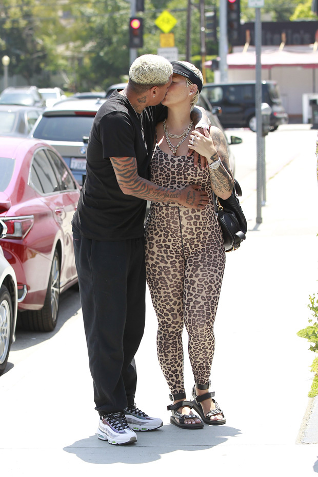 Amber Rose shows off her blossoming baby bump with her boyfriend Alexander