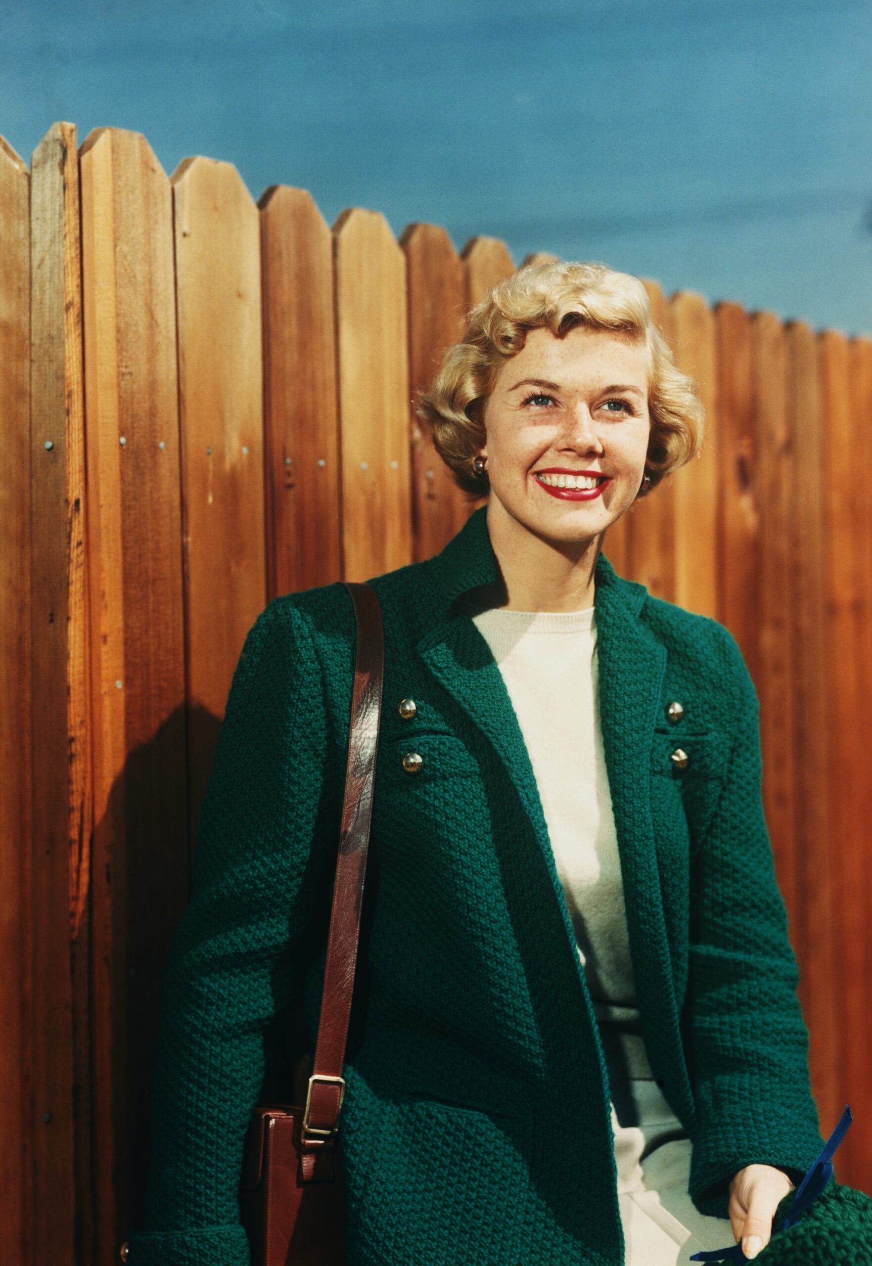 Doris Day in Green Jacket by Fence (Photo by Herbert Dorfman/Corbis via Getty Images)