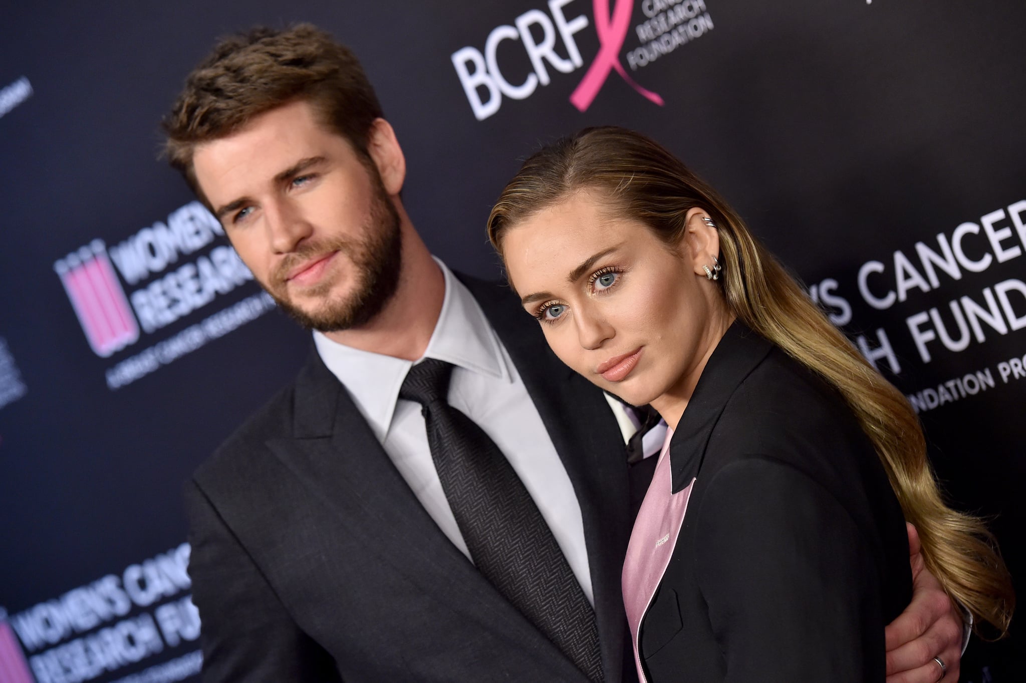 BEVERLY HILLS, CALIFORNIA - FEBRUARY 28: Liam Hemsworth and Miley Cyrus attend The Women