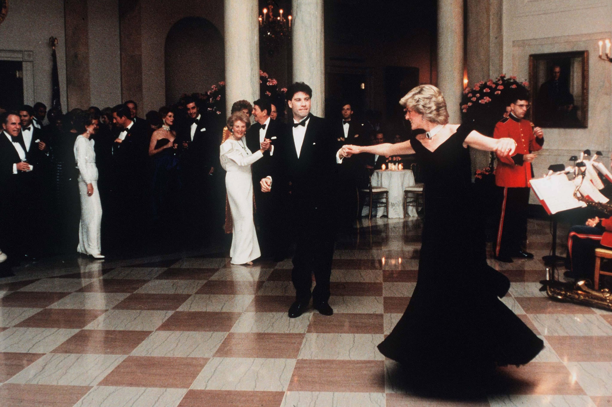 WASHINGTON, UNITED STATES - NOVEMBER 09:   (FILE PHOTO) Diana, Princess Of Wales, watched by President Ronald Reagan and wife Nancy,  dances with John Travolta at the White House, USA  on November 9, 1985.  Diana is wearing a midnight blue velvet dress by designer Victor Edelstein. (Photo by Anwar Hussein/WireImage)On July 1st  Diana, Princess Of Wales would have celebrated her 50th BirthdayPlease refer to the following profile on Getty Images Archival for further imagery. http://www.gettyimages.co.uk/Search/Search.aspx?EventId=107811125&EditorialProduct=ArchivalFor further images see also:Princess Diana:http://www.gettyimages.co.uk/Account/MediaBin/LightboxDetail.aspx?Id=17267941&MediaBinUserId=5317233Following Diana