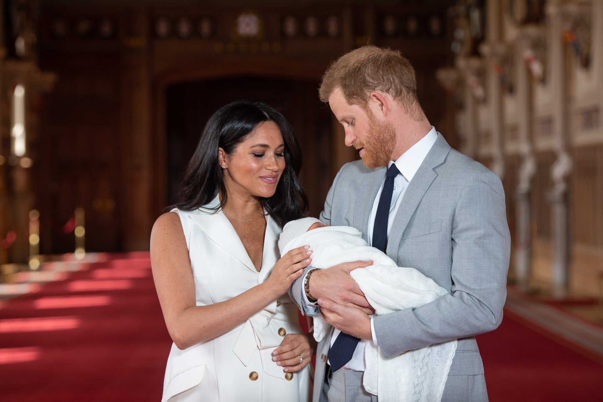 WINDSOR, ENGLAND - MAY 08: Prince Harry, Duke of Sussex and Meghan, Duchess of Sussex, pose with their newborn son Archie Harrison Mountbatten-Windsor during a photocall in St George