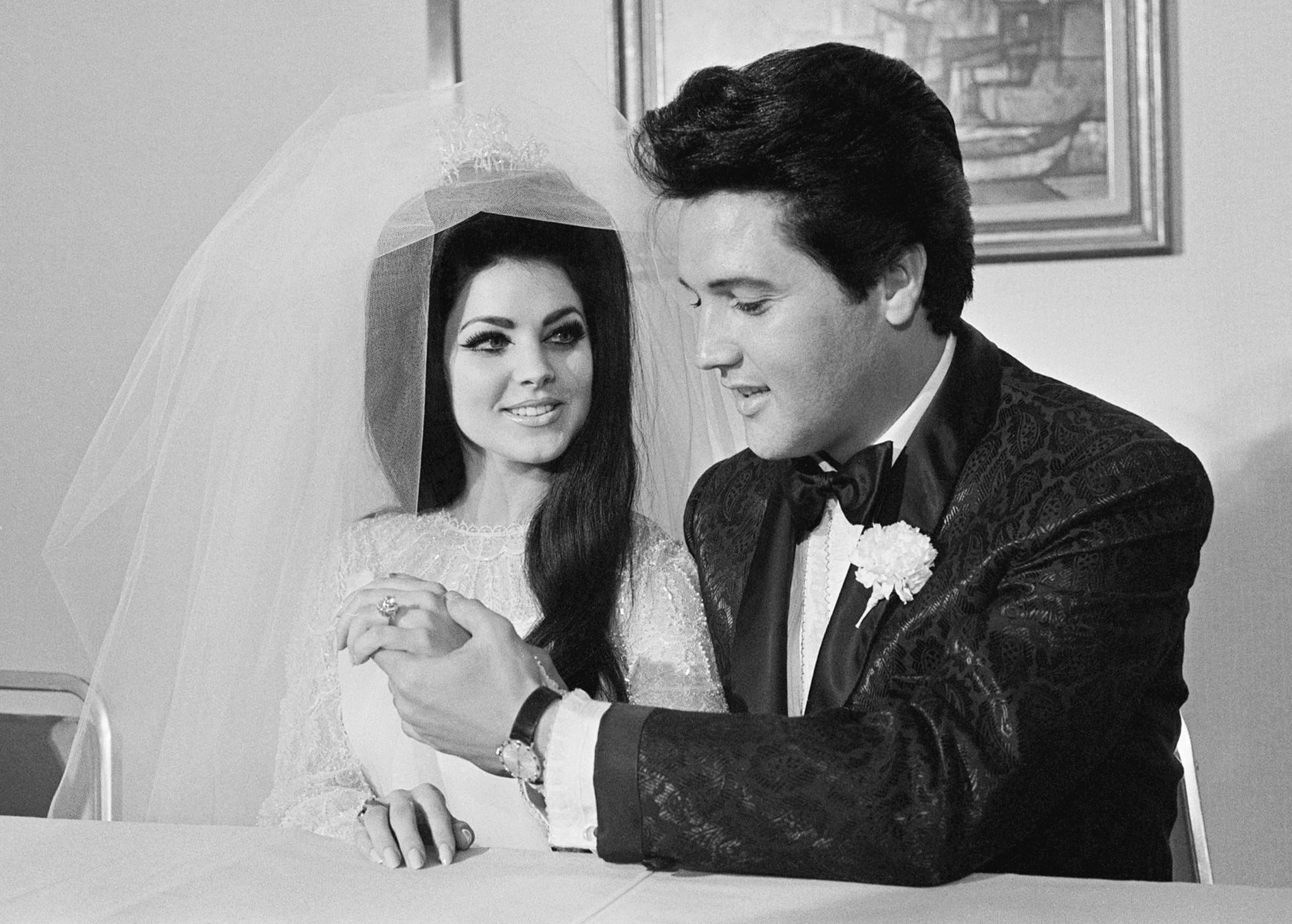 Elvis Presley shows off his wife Princilla