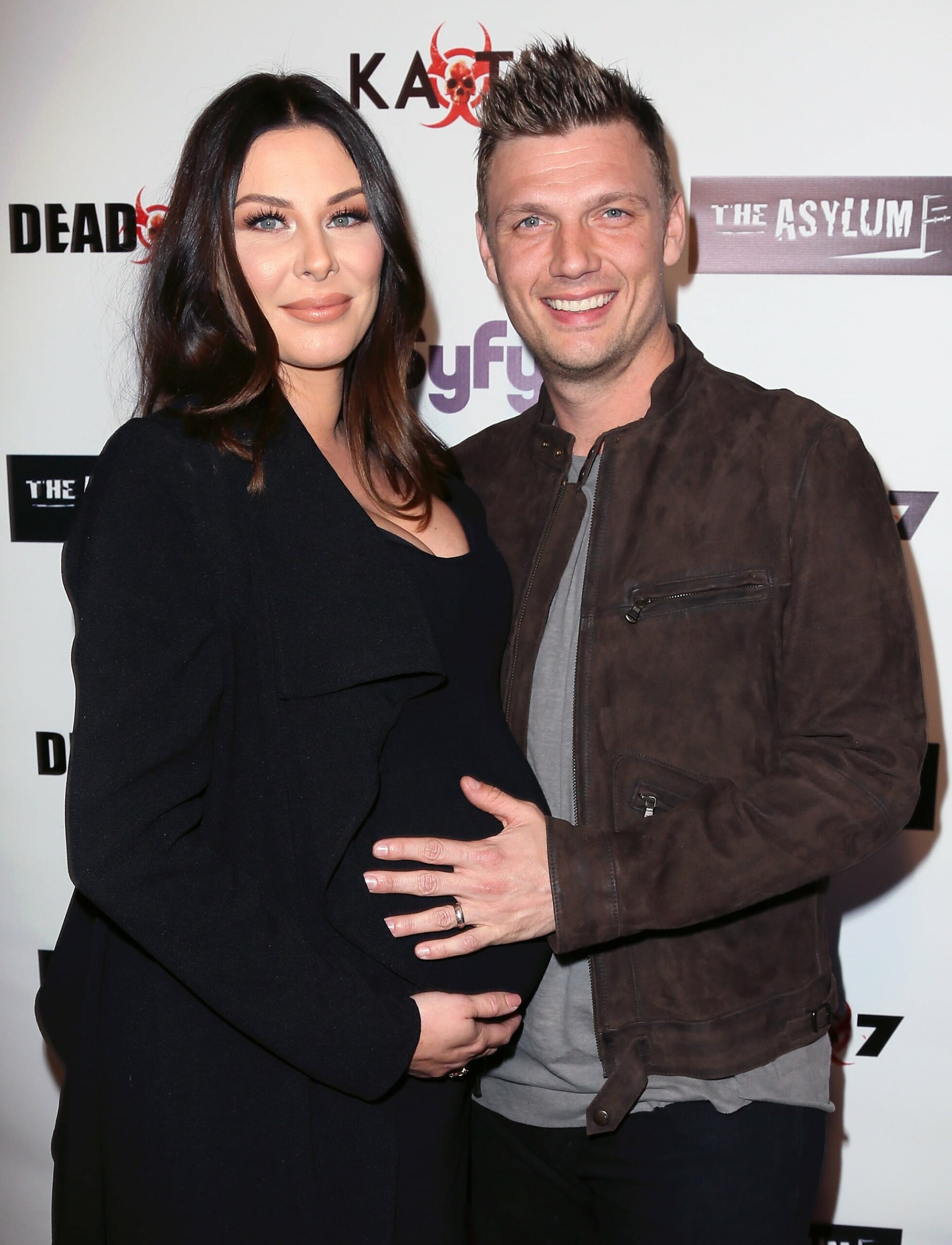 LOS ANGELES, CALIFORNIA - APRIL 01:  Singer Nick Carter (R) and wife Lauren Kitt attend the premiere of Syfy