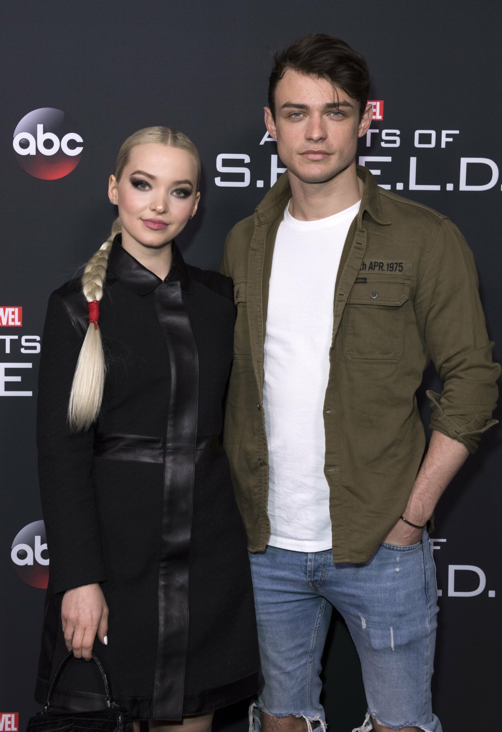 Actors Dove Cameron (L) and Thomas Doherty attend Marvels Agents of S.H.I.E.L.D. 100th Episode Celebration in Hollywood, California, on February 24, 2018.  / AFP PHOTO / VALERIE MACON        (Photo credit should read VALERIE MACON/AFP/Getty Images)
