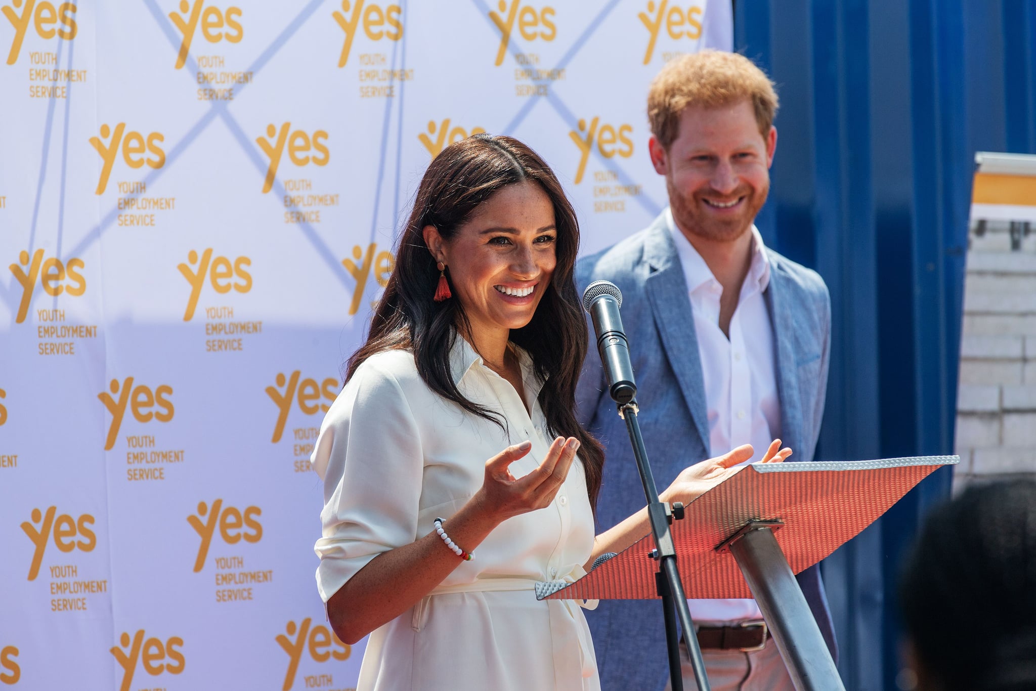Meghan, Duchess of Sussex(L), is watched by Britain