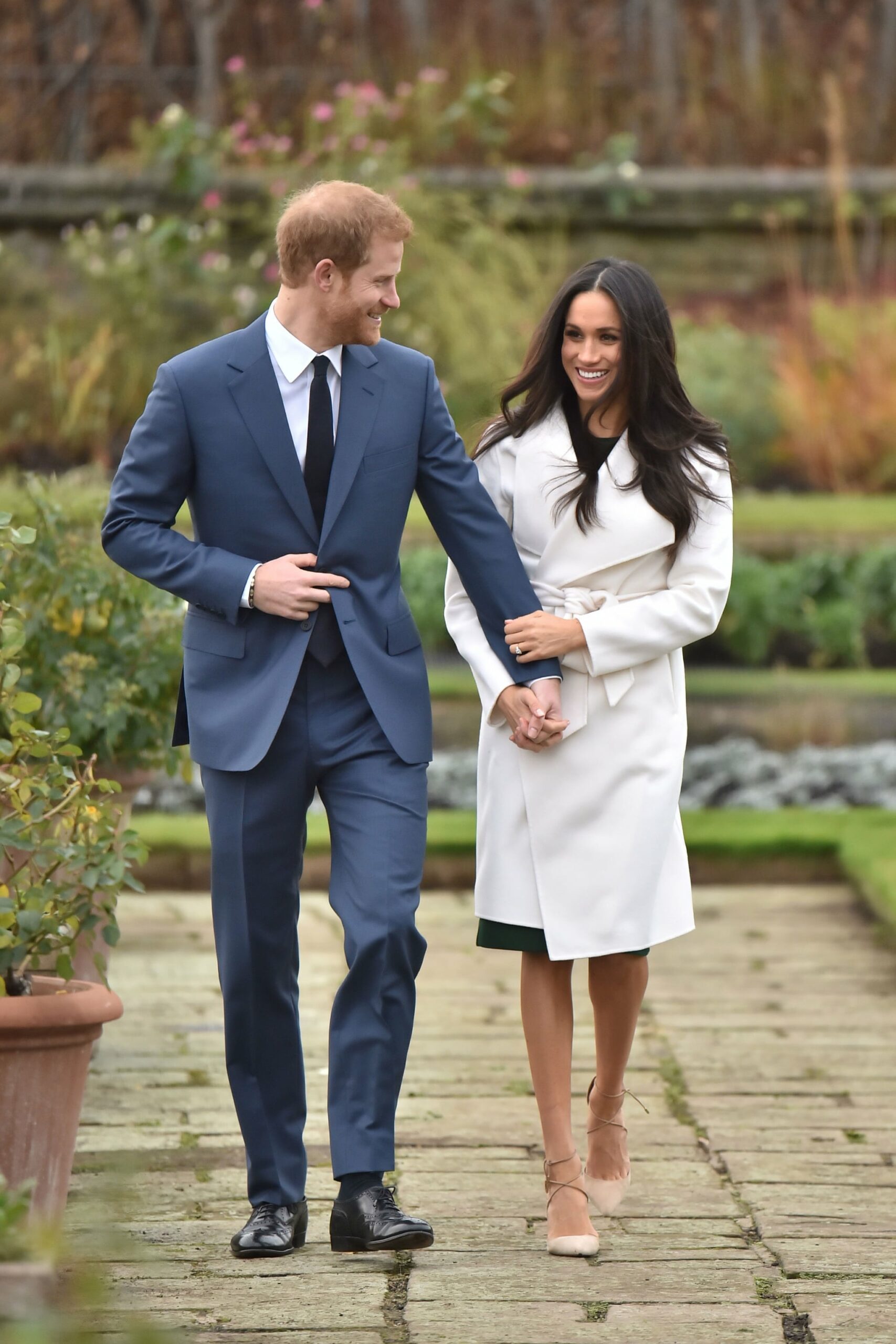 Prince Harry and Meghan Markle in the Sunken Garden at Kensington Palace, London, after the announcement of their engagement.