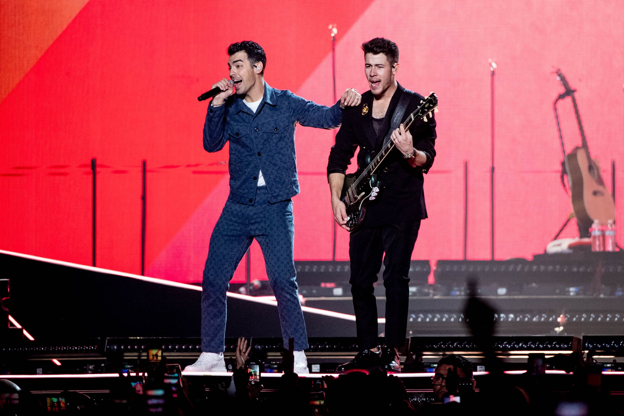 INGLEWOOD, CALIFORNIA - DECEMBER 14: Joe Jonas and Nick Jonas perform onstage at
